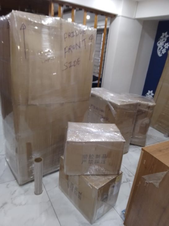 Professional packing of refrigerator and household goods with stretch film and corrugated padding for Chennai to Kerala move