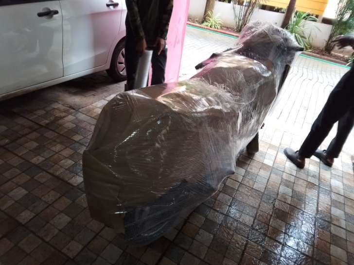 On-site two-wheeler bike packing with corrugated sheets and stretch wrap film for Chennai to Dindigul transport