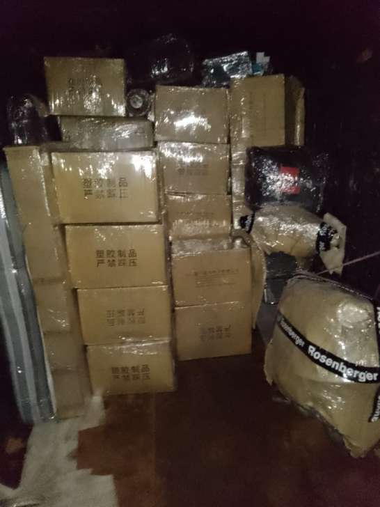 Packers and movers Chennai to Trivandrum live container truck loading with stretch-film wrapped boxes and padded bike